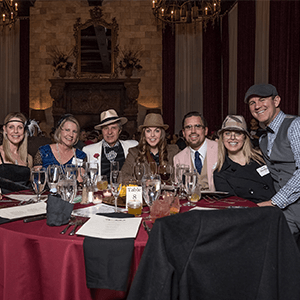 San Francisco Murder Mystery party guests at the table
